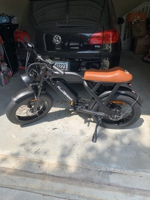 Customer MEGAWHEELS fat tire electric bike in a garage