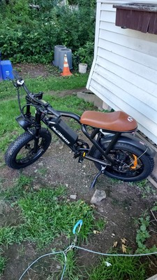 Customer MEGAWHEELS-style fat tire electric bike beside a home